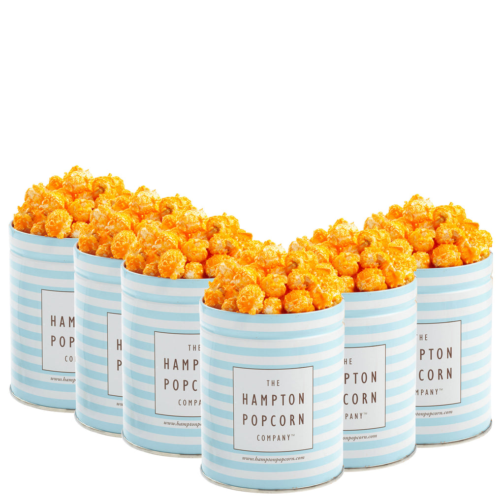 This is a 6 pack of classic quart tins filled with orange cheddar cheese popcorn.